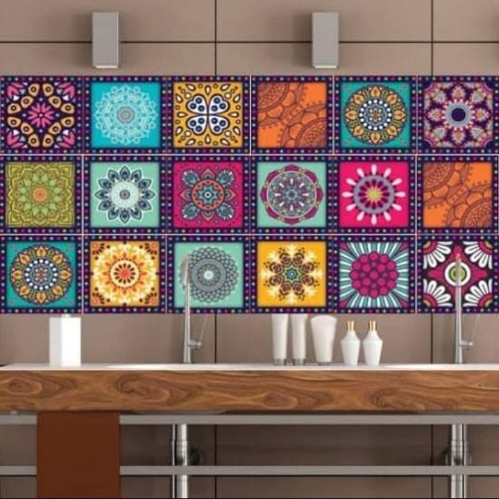 Colorful patterned mandala tiles decorating a bathroom wall above a wooden vanity.