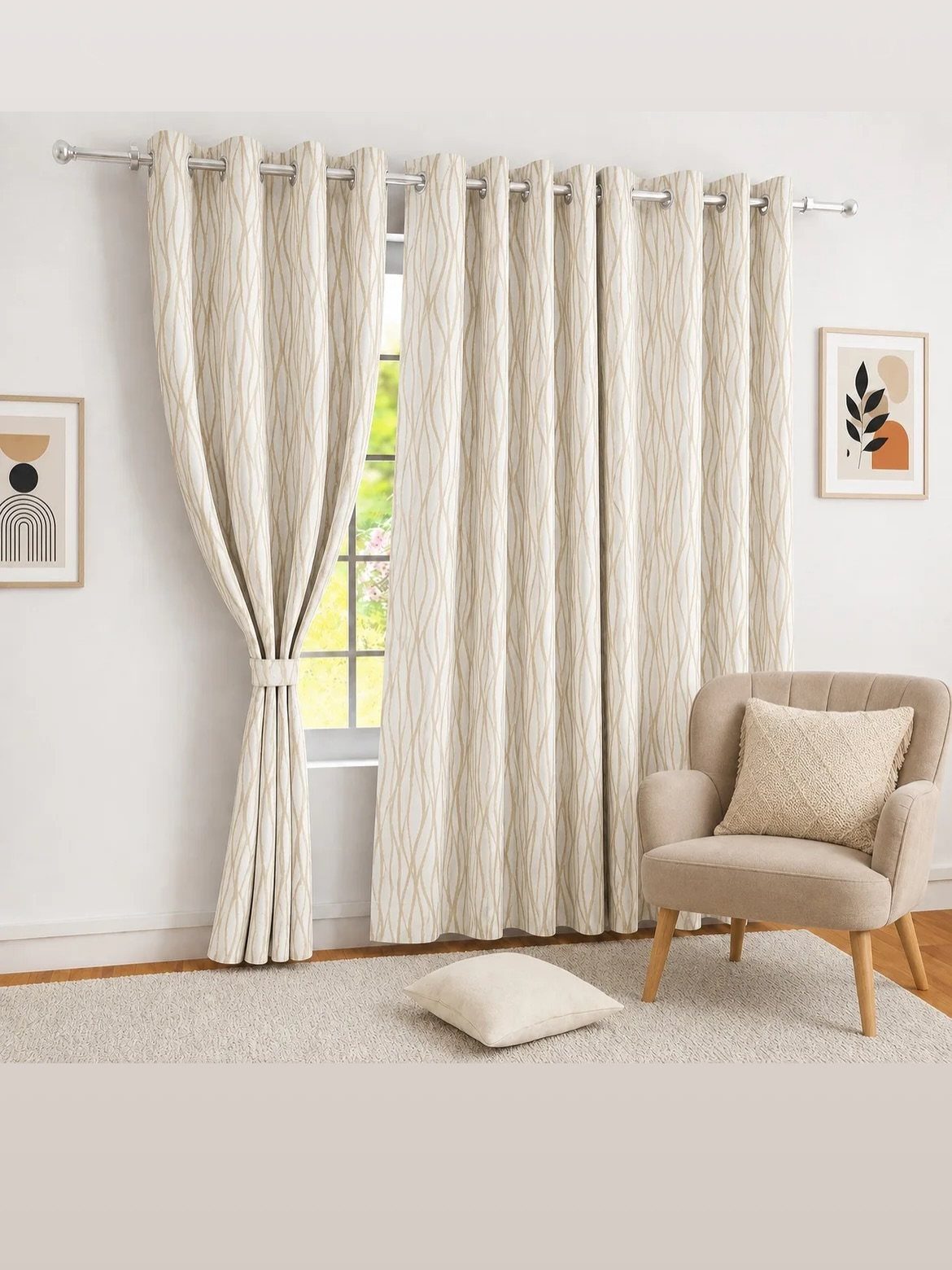 Cream patterned curtains hanging on a silver rod over a window in a beige living room.