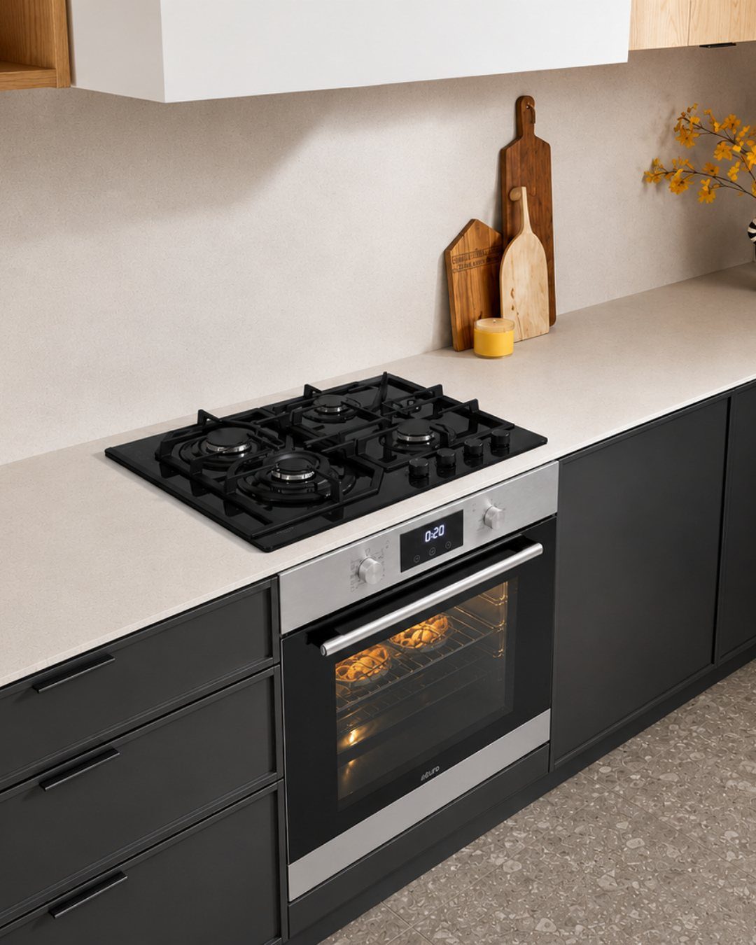 Matte black kitchen cabinets paired with a stainless steel oven and black gas stovetop.