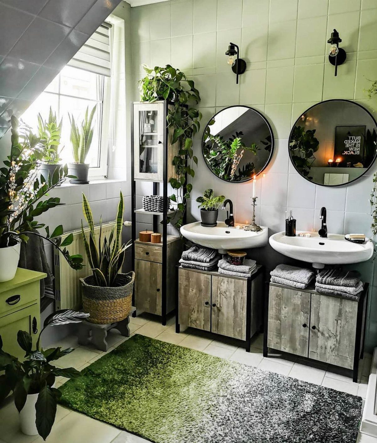 Green potted plants arranged on shelves and floors in a light green tiled bathroom.