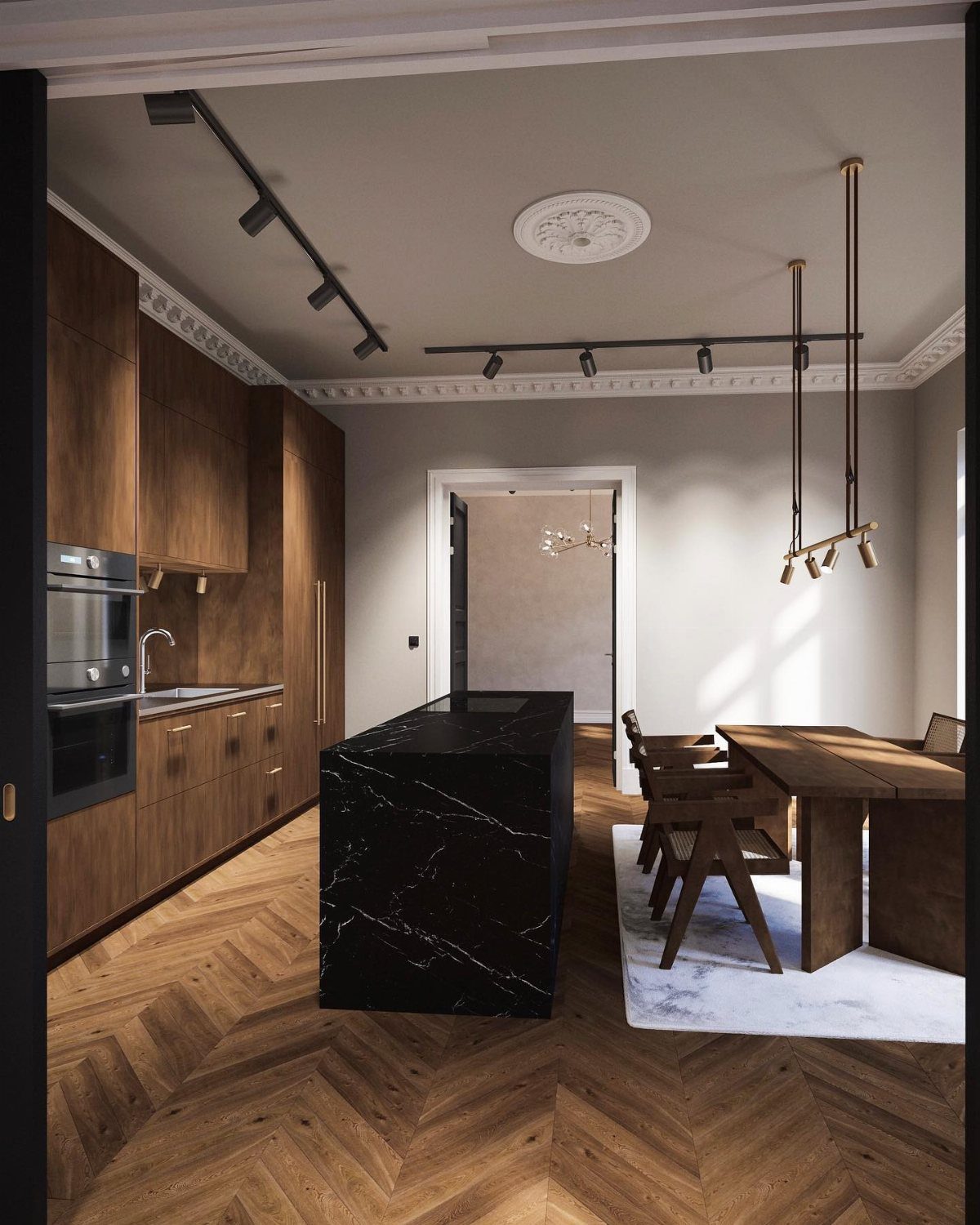 Modern kitchen with dark wood cabinets, black marble island, and herringbone wood floors.