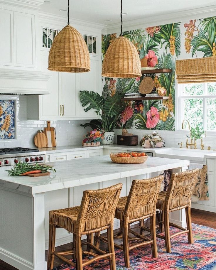 A bright kitchen with tropical floral wallpaper and woven rattan pendant lights and stools.