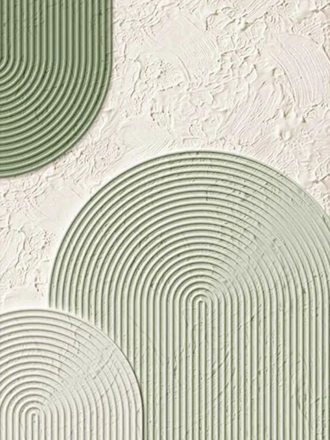 Sage green textured semi-circle wall panels on a white stuccoed background.