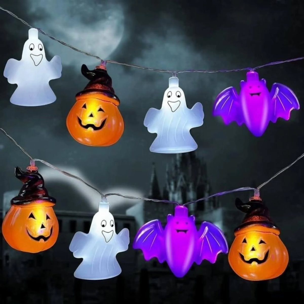 Glowing Halloween string lights with ghosts, pumpkins, and bats against a dark night sky.