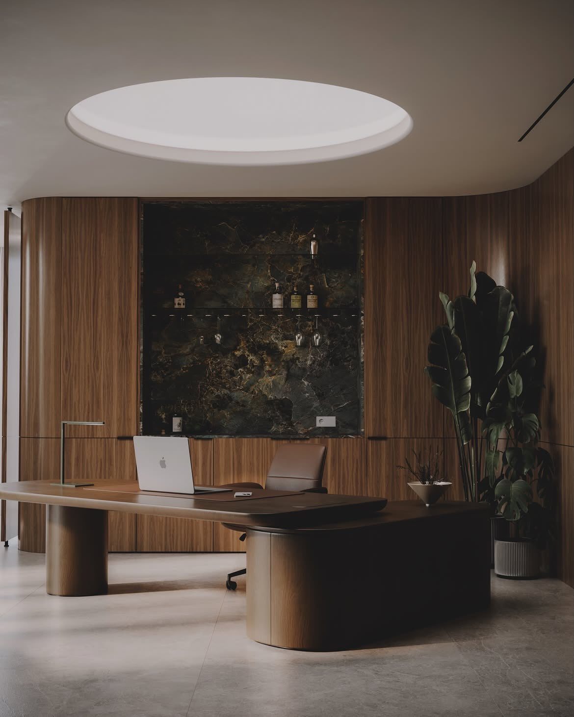 Large circular recessed ceiling light illuminating a modern wooden desk and wood-paneled office walls.