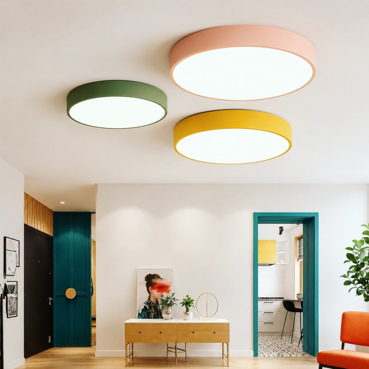 Three colorful circular flush mount lights in pink, yellow, and green mounted on a white ceiling.