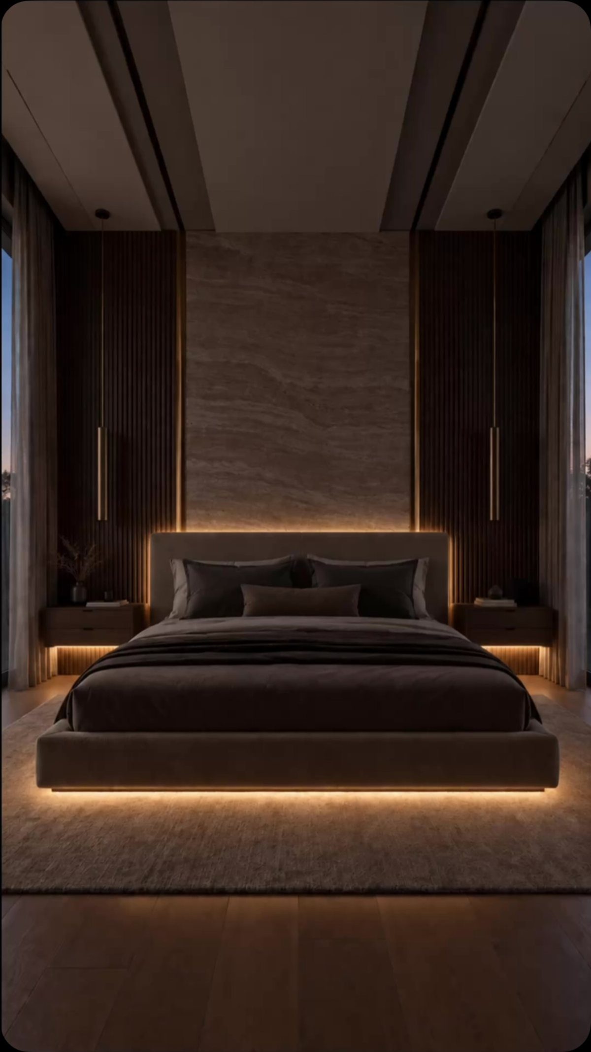 Modern bedroom with integrated bed lighting, backlit headboard, and hanging pendant lights.