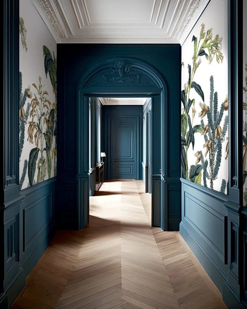 Hallway with teal wainscoting and white botanical floral wallpaper with cactus patterns.