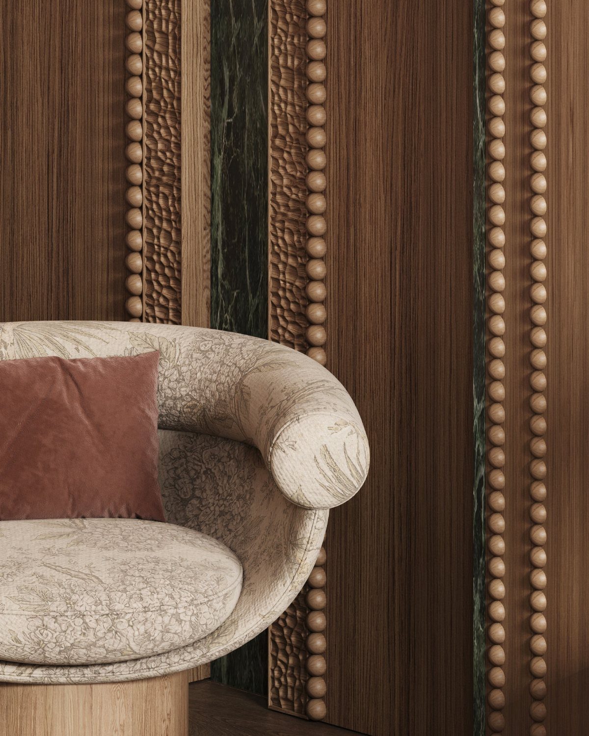 Patterned beige armchair with a rose velvet pillow against decorative dark wood paneled walls.