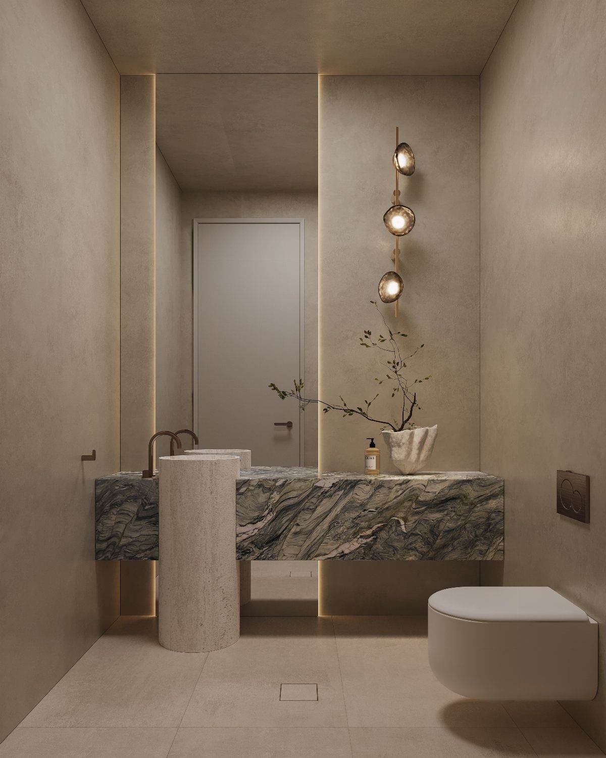 Marble vanity and stone pedestal sink in a minimalist beige bathroom with warm lighting.