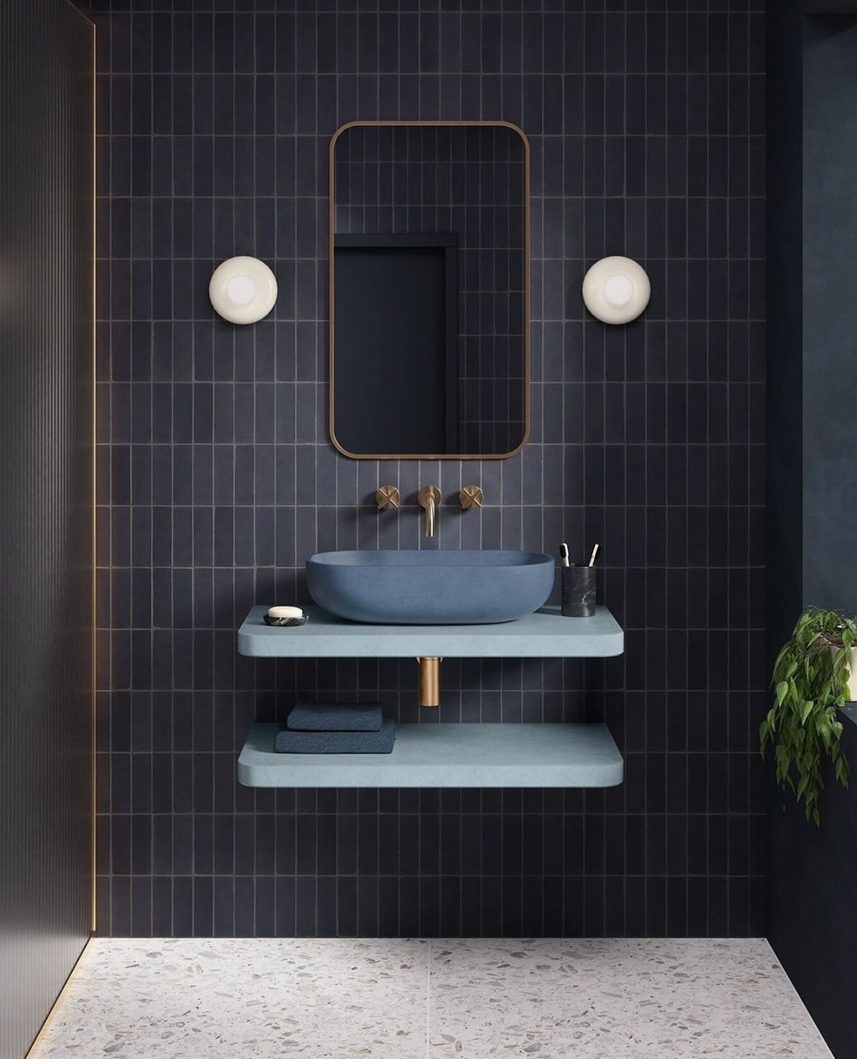 Two light blue open shelves holding a blue vessel sink and folded towels against dark tiles.