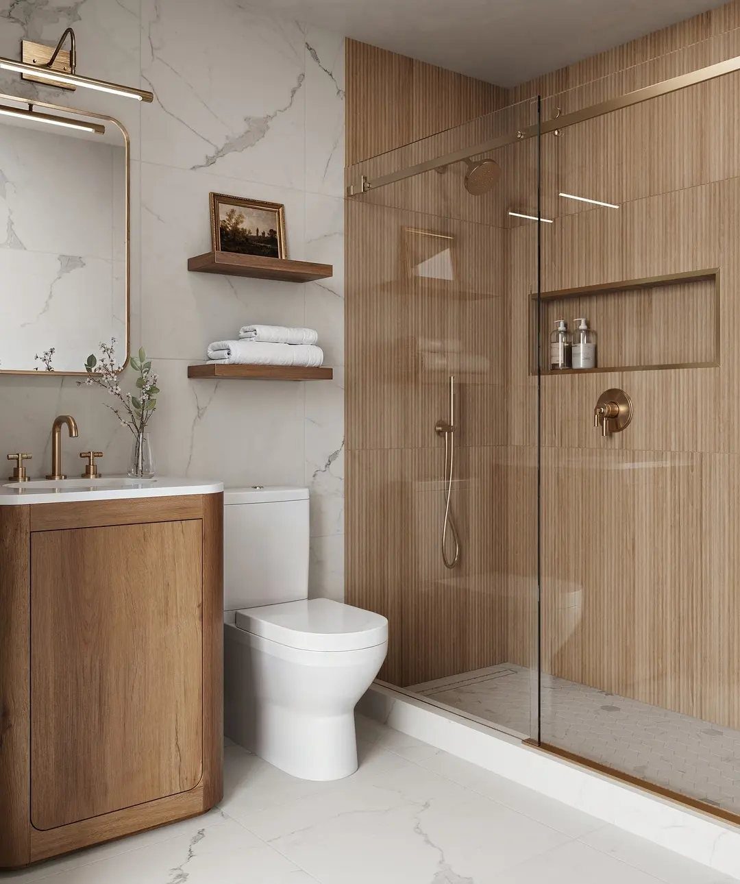 Modern bathroom with wooden vanity, marble walls, and gold metallic hardware accents.